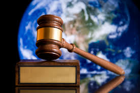 Image of a gavel with a satellite image of Earth in the background